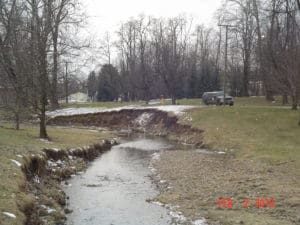 Streambank experiencing severe undercutting and erosion